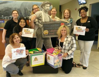 WRCU team posing with the school supply drive donated supplies