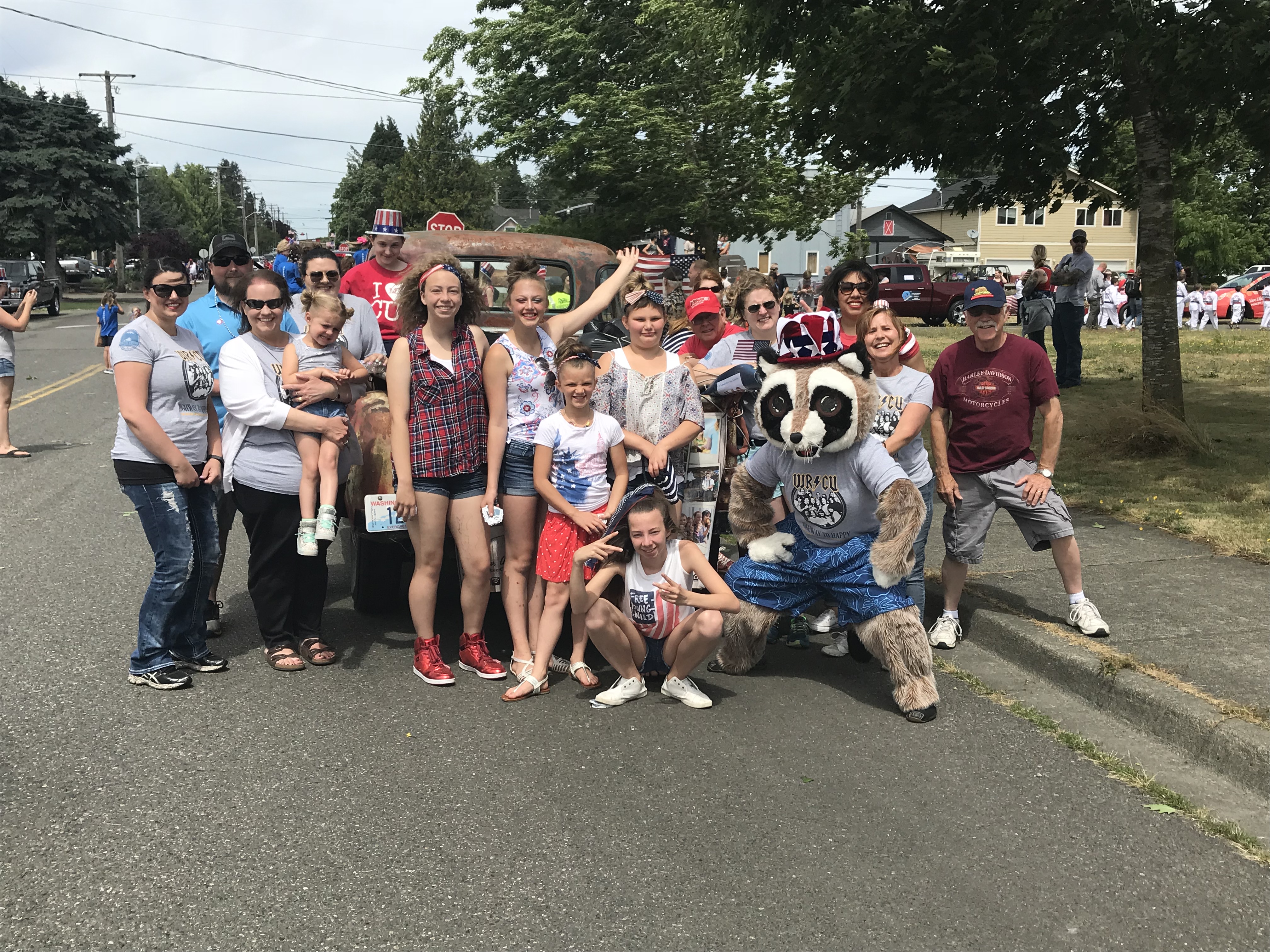 Group of people standing in front of truck