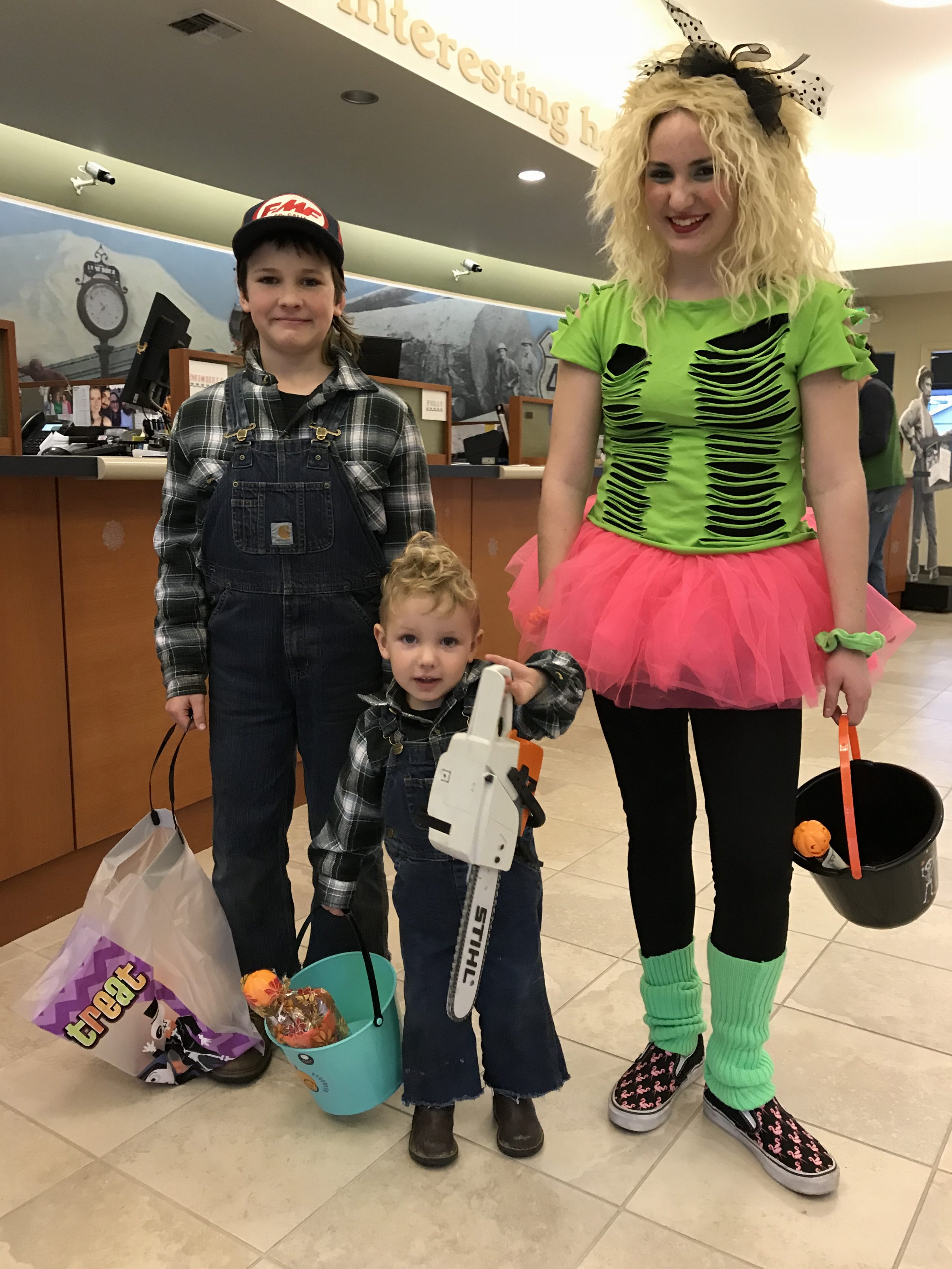 Kids and lady dressed up for Halloween