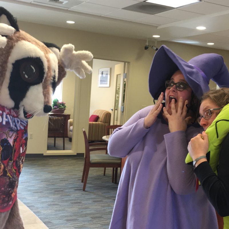 Financial education for kids blog. Rocky Raccoon is pretending to scare his friends at WRCU for a Halloween celebration.
