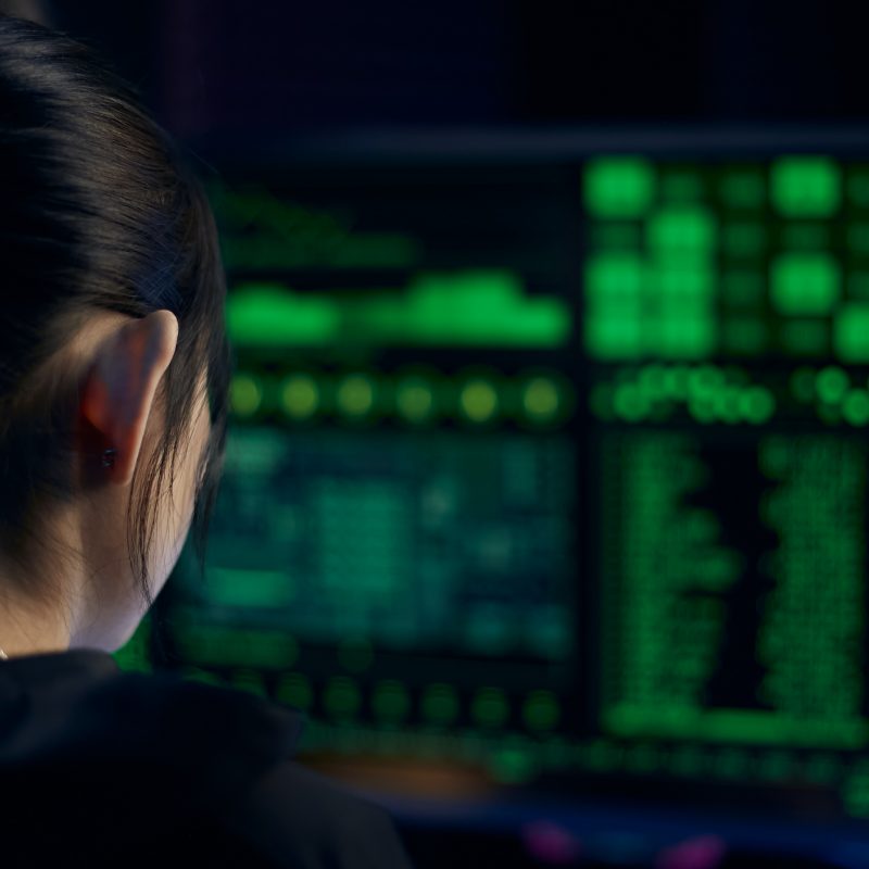 hacker sitting at computer looking at screen