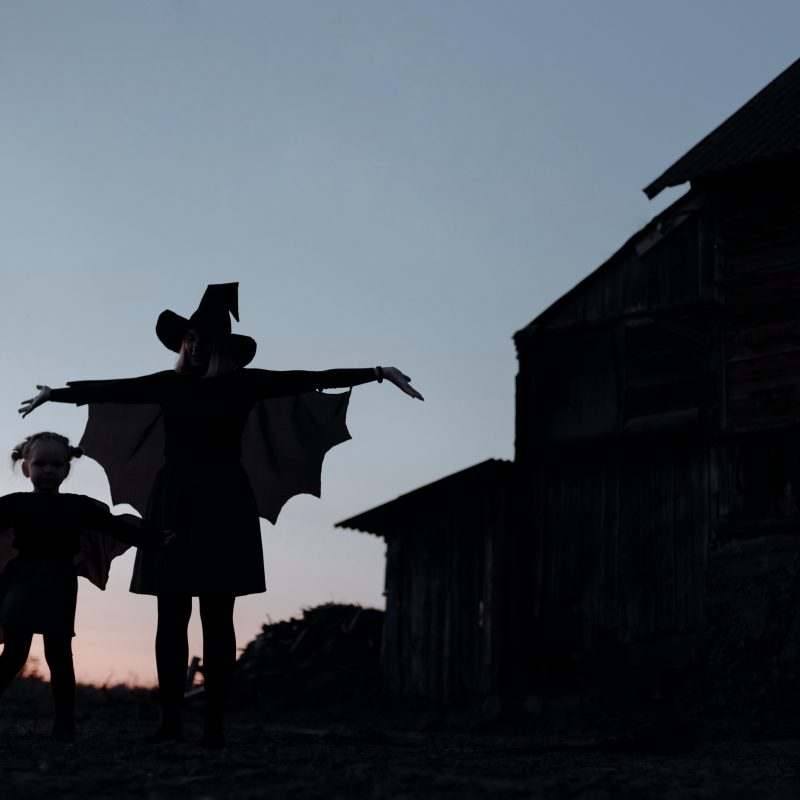 Two silhouettes in halloween costumes on a blog about when to consolidate debt