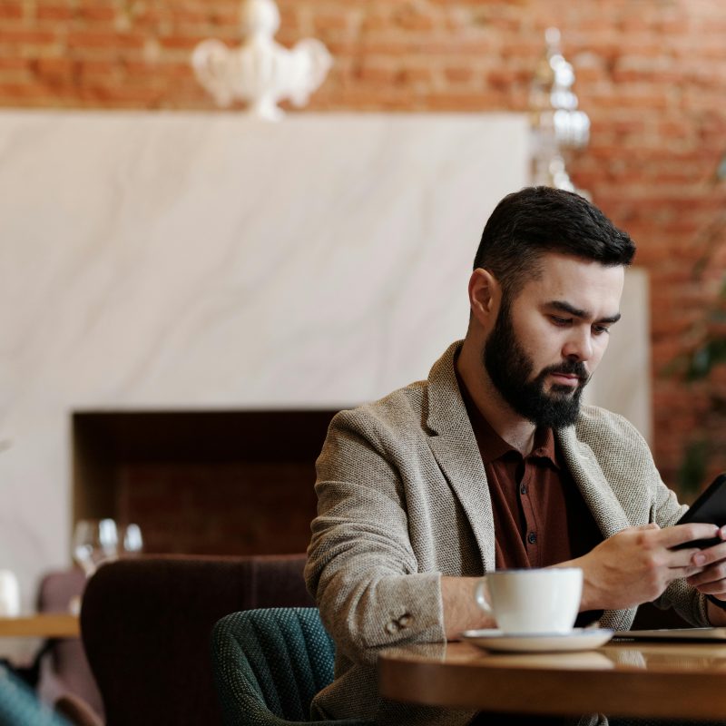 A man looking confused at a computer on a blog about social engineering